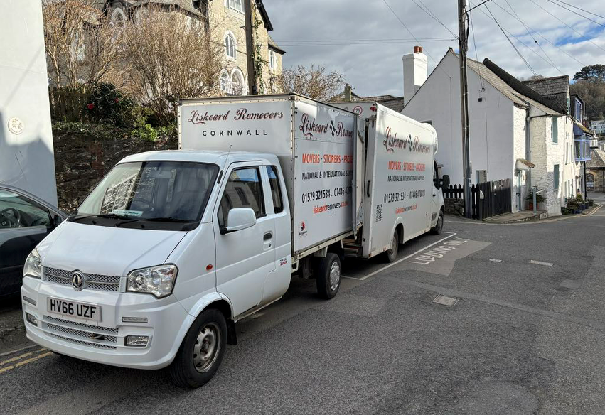An image of a Narrow Vehicle receiving items from a normal sized van